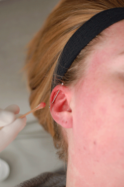 see how the barbell is not pressing against the back of her ear - perfect!