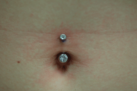 Adrienne's got a great stomach for a navel piercing!